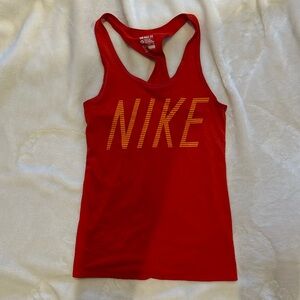 Red “the Nike tee, dri-fit” with orange lettering XS